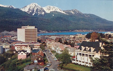 Featured is a postcard image of Juneau, Alaska's capital, c 1960. The two largest buildings are the Governor's Mansion and the "new" Federal Building.  The original unused card is for sale in The unltd.com Store.